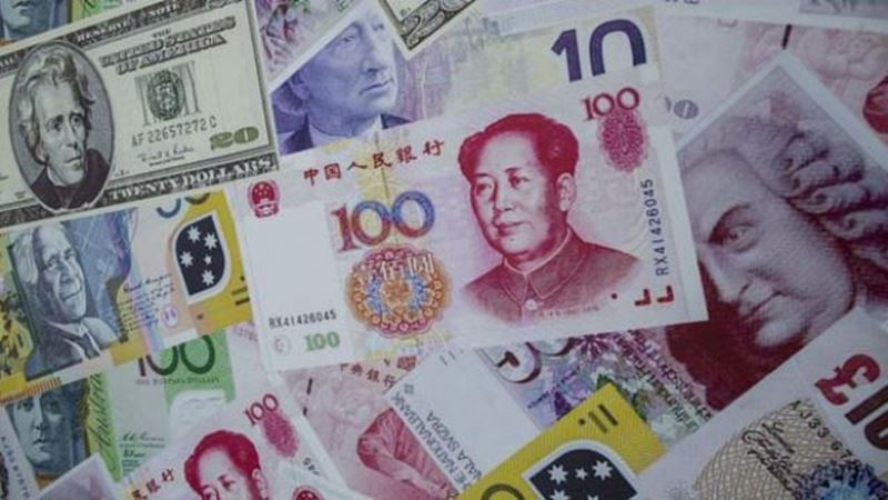 Chinese economists call for easing capital controls